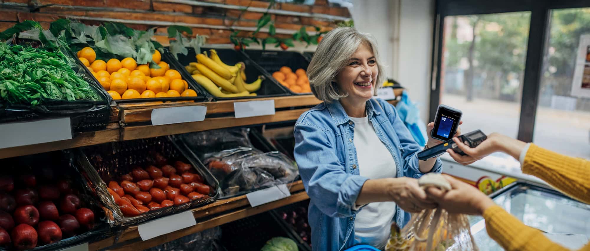 Women buying fruit and vegetables