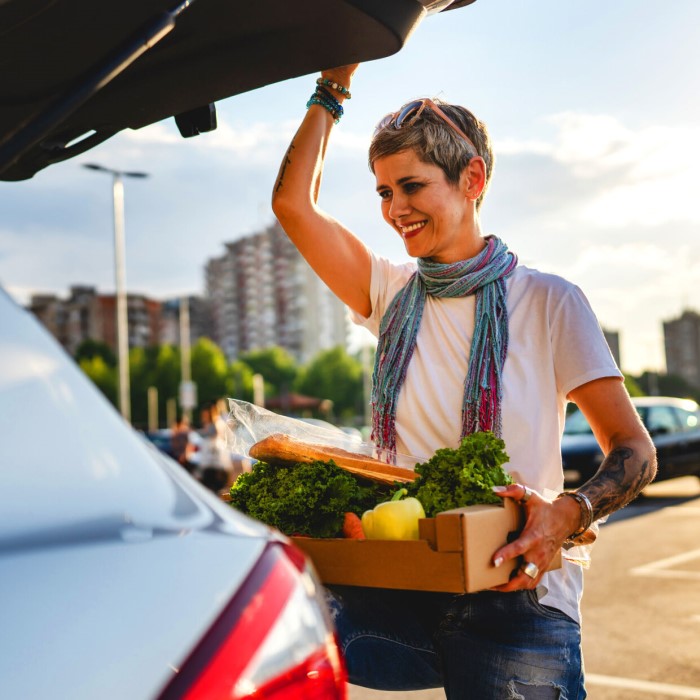 Lady opening car boot