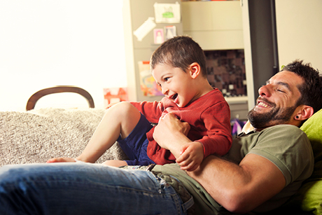 man on sofa with young boy 