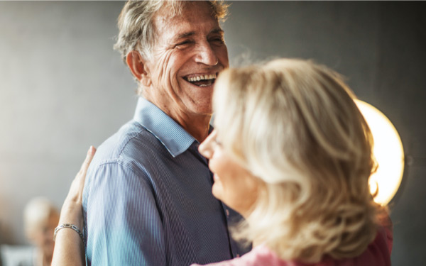 Older couple dancing and laughing