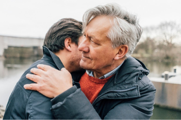 Father and son embracing
