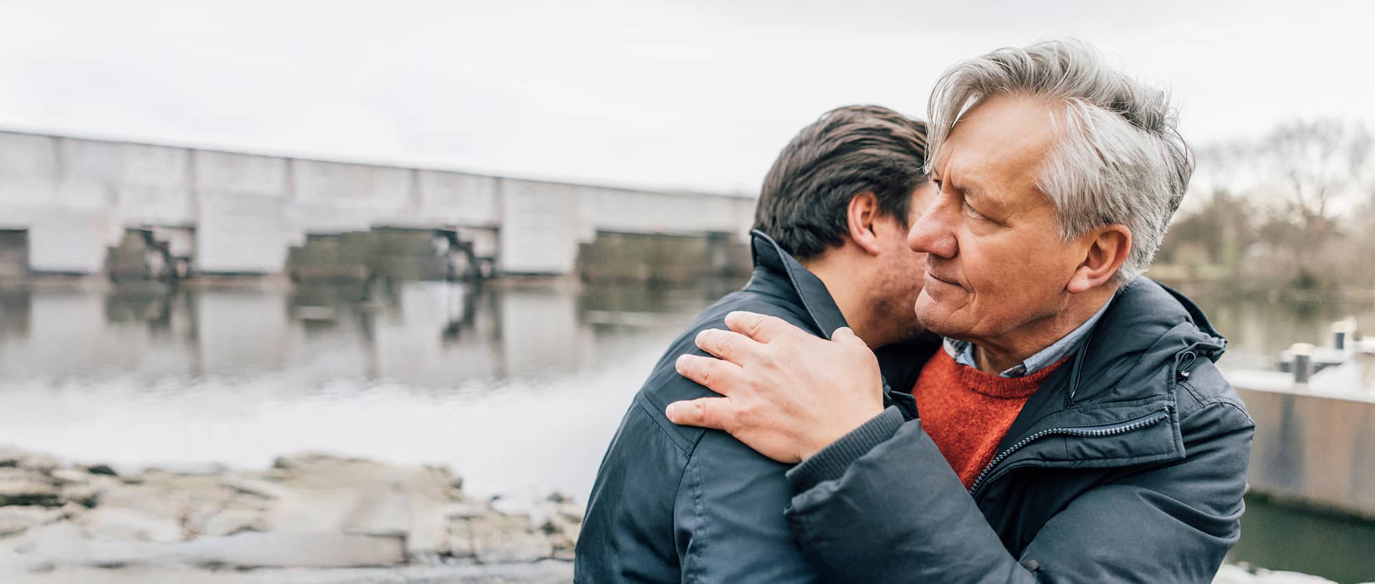 Father and son hugging.