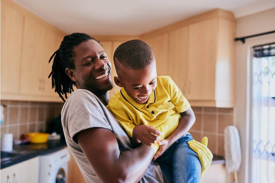 Man and boy playing