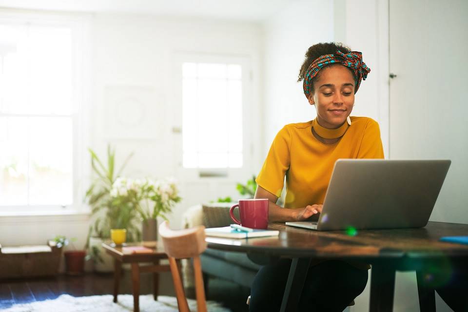 Woman relaxing on laptop