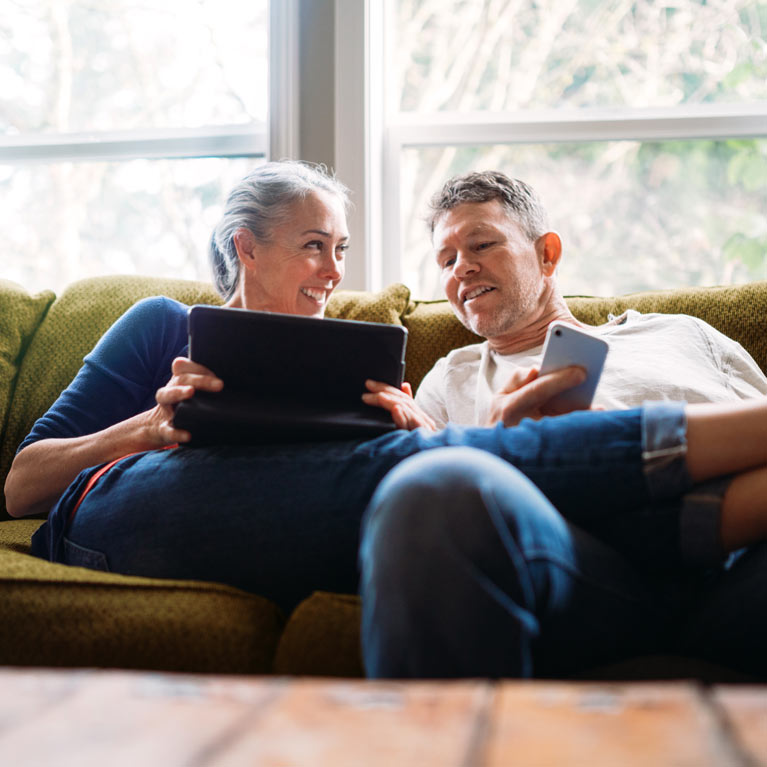 Man and woman looking at laptop.