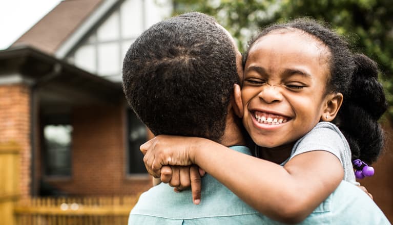Image showing a man and child hugging