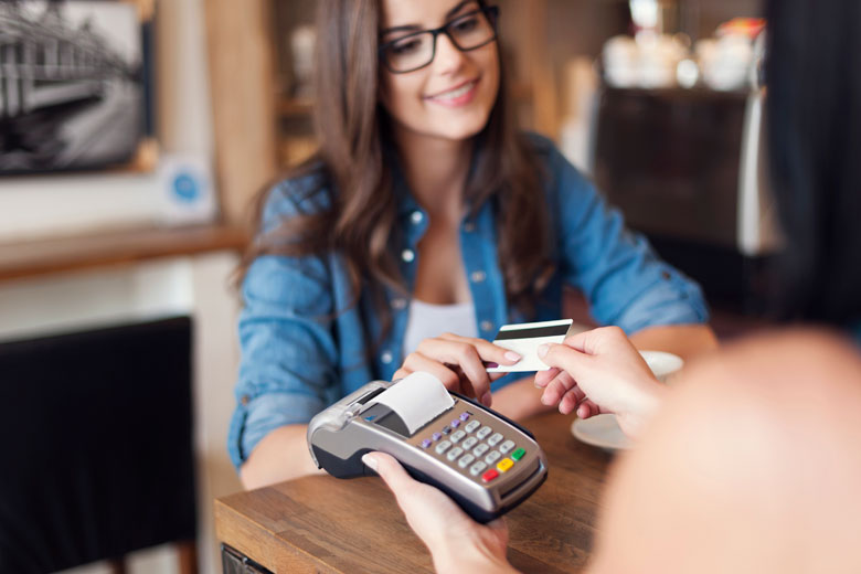 Woman paying with a bank card