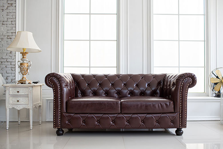 mahogany couch in room
