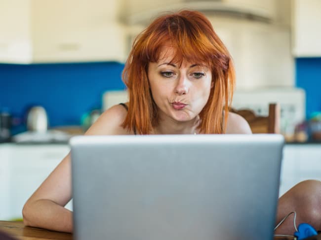 Girl with sunglasses looking at her phone