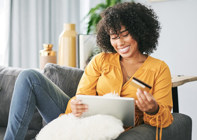 woman on sofa smiling