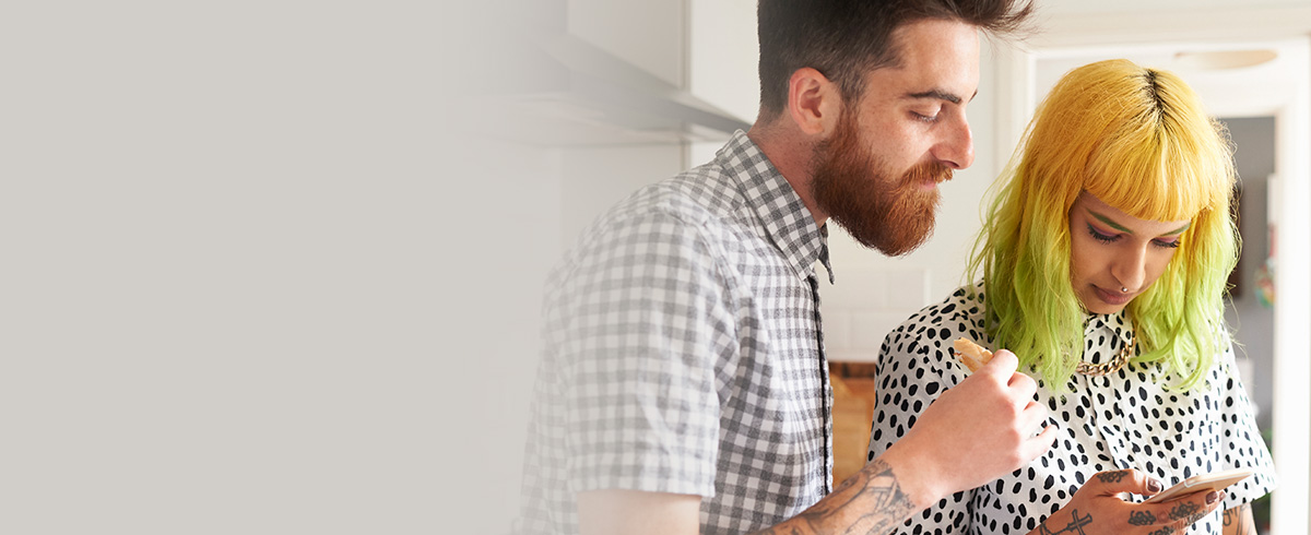 Man and woman looking at phone