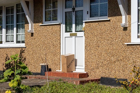 Brown parcel sat on a door step