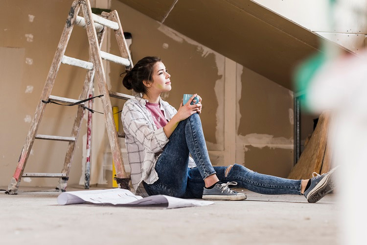 Lady taking a break from making home improvements