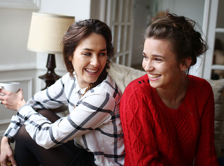 Two people laughing.