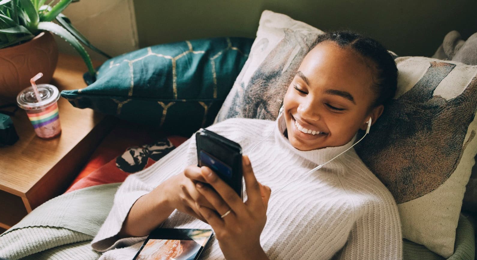 Young person looking at mobile phone