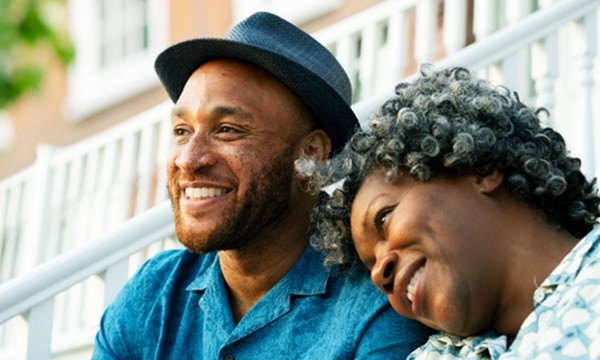 An image of a middle age couple looking happy.