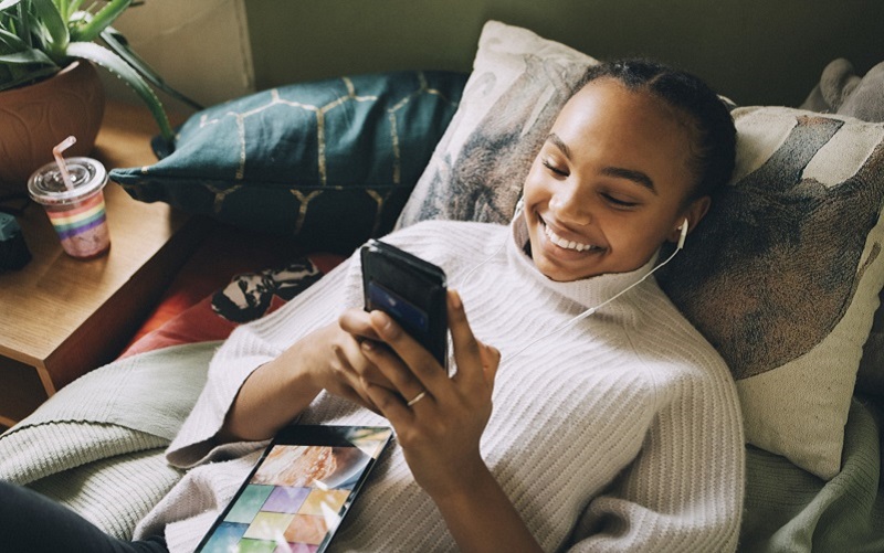 Young person looking at their mobile phone